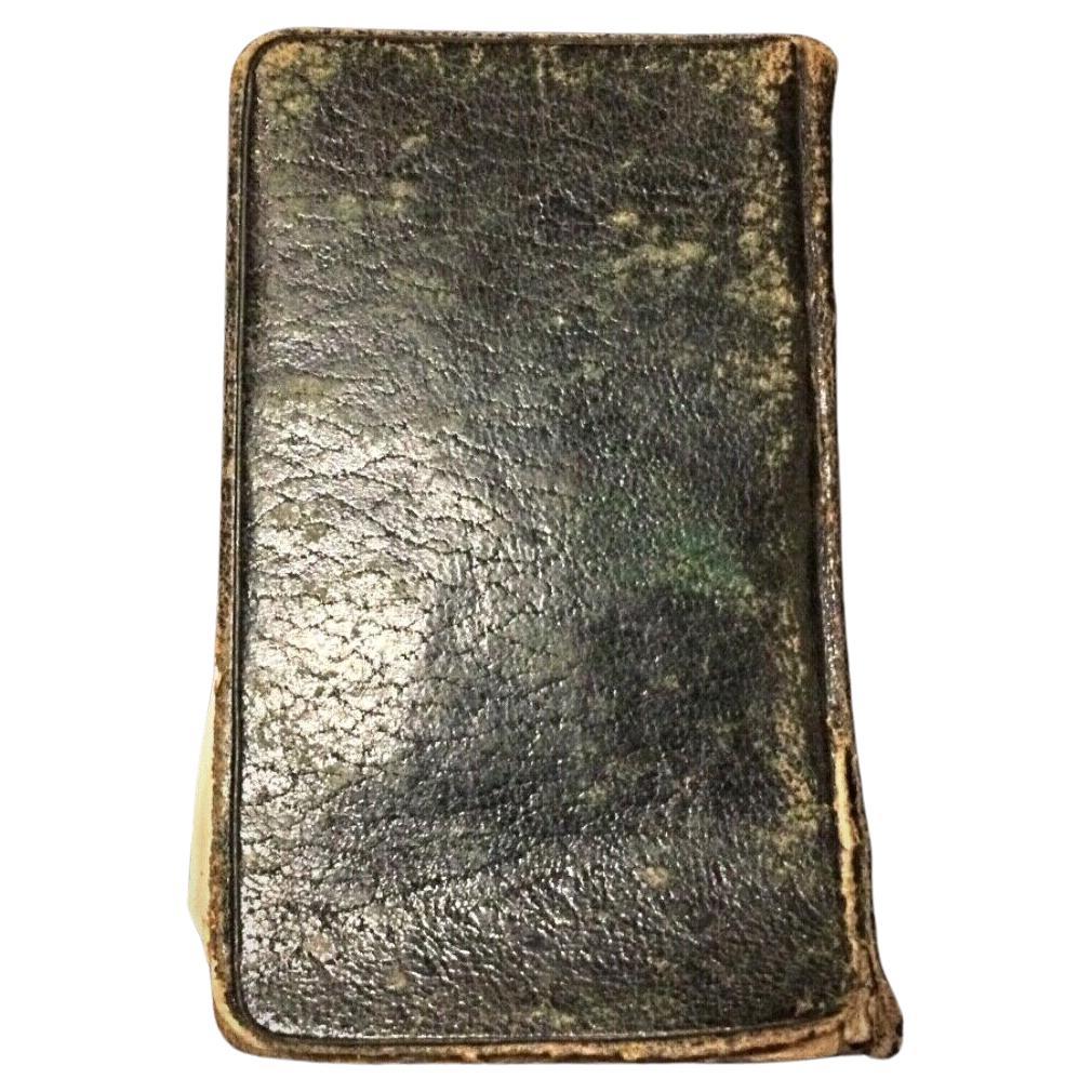 "Antique Roman Missal Book from the 1790s with worn cover and yellowed pages.