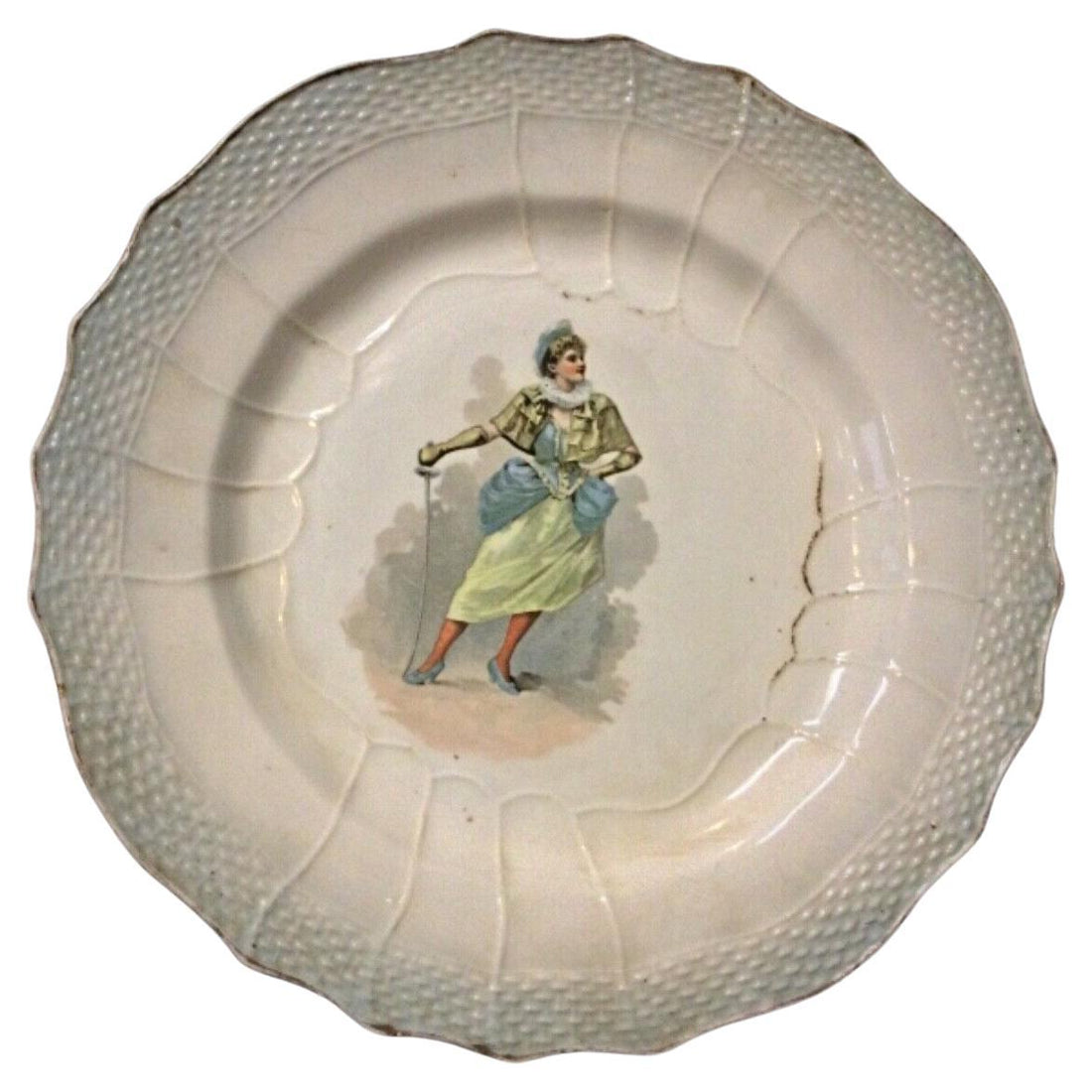 Antique faience plate featuring the "Hamage Nord" design with a woman holding a sword.