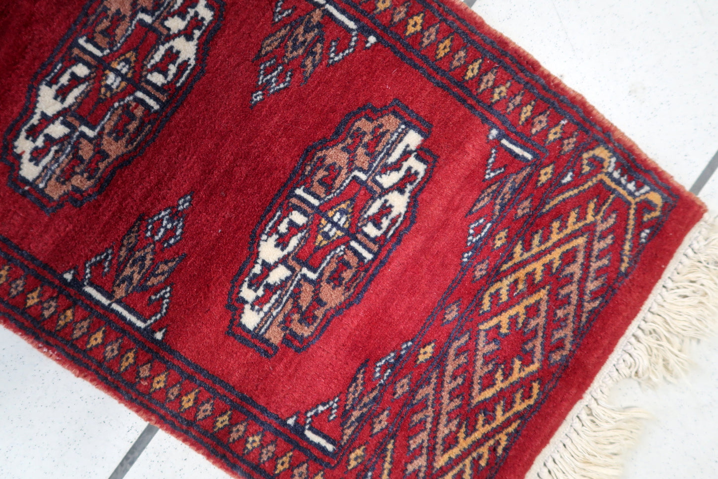 Close-up of Symmetrical Patterns on Central Geometric Motifs of Handmade Vintage Uzbek Bukhara Rug - 1960s