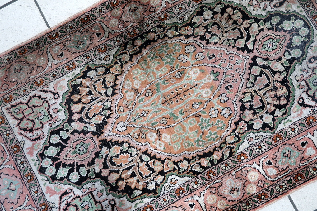 A close-up of the silk fibers, highlighting the rug’s softness and quality
