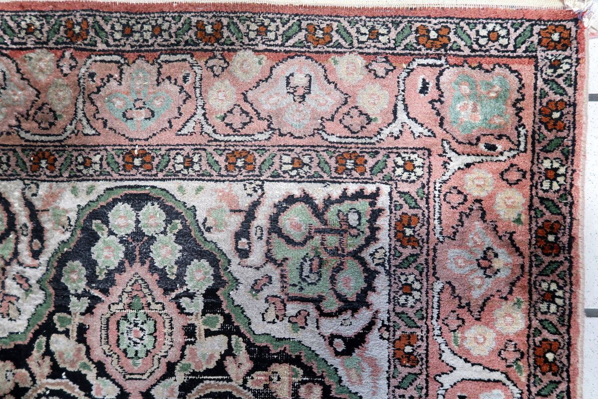 Close-up of the hand-knotted silk texture on this 1950s Persian rug
