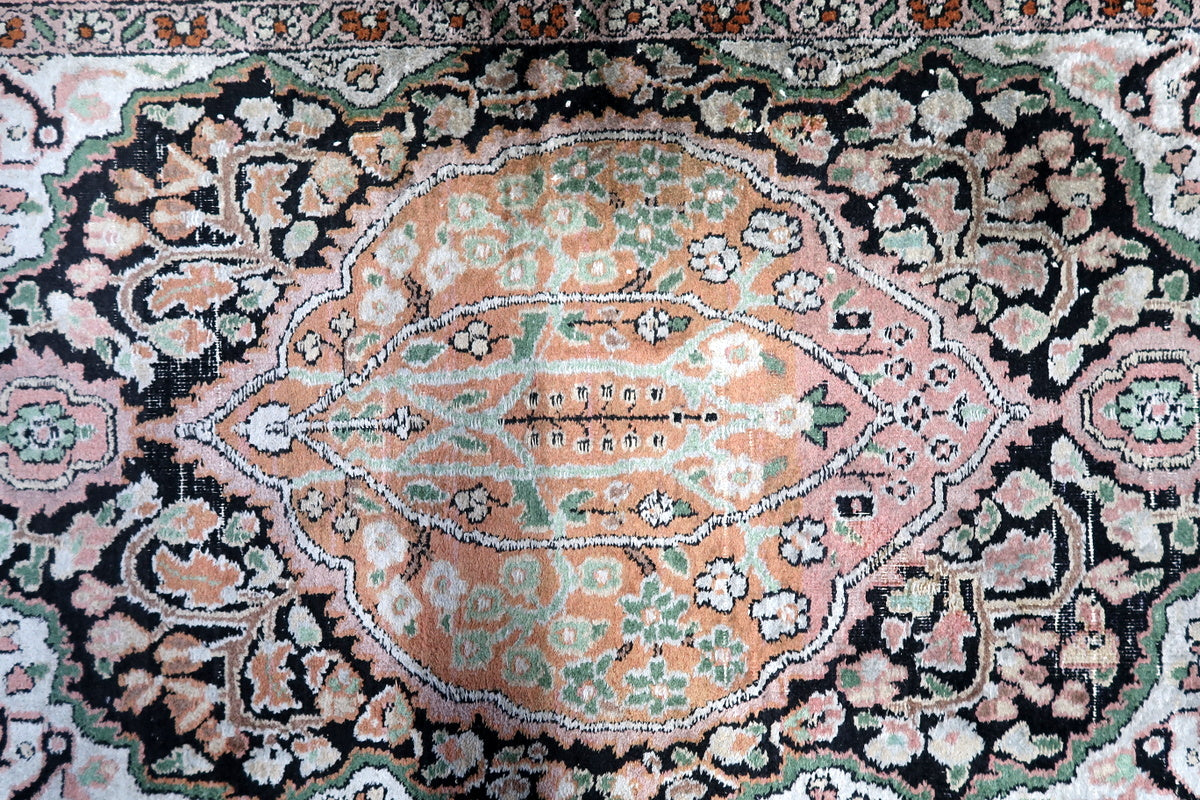 A close-up of the medallion center, highlighting Persian craftsmanship
