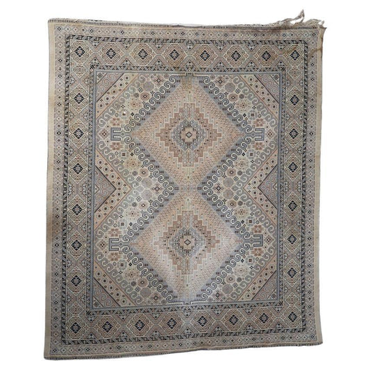 Vintage Caucasian Shirvan-style textile with intricate tribal motifs
