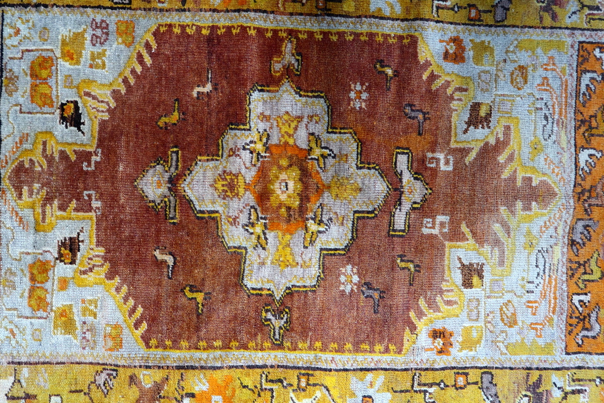 Corner detail showing the natural fraying and aged character of the rug
