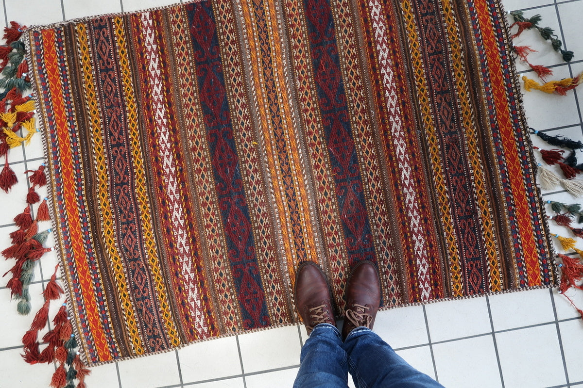 Unique Moroccan wool rug with timeworn natural dye patterns, perfect for collectors
