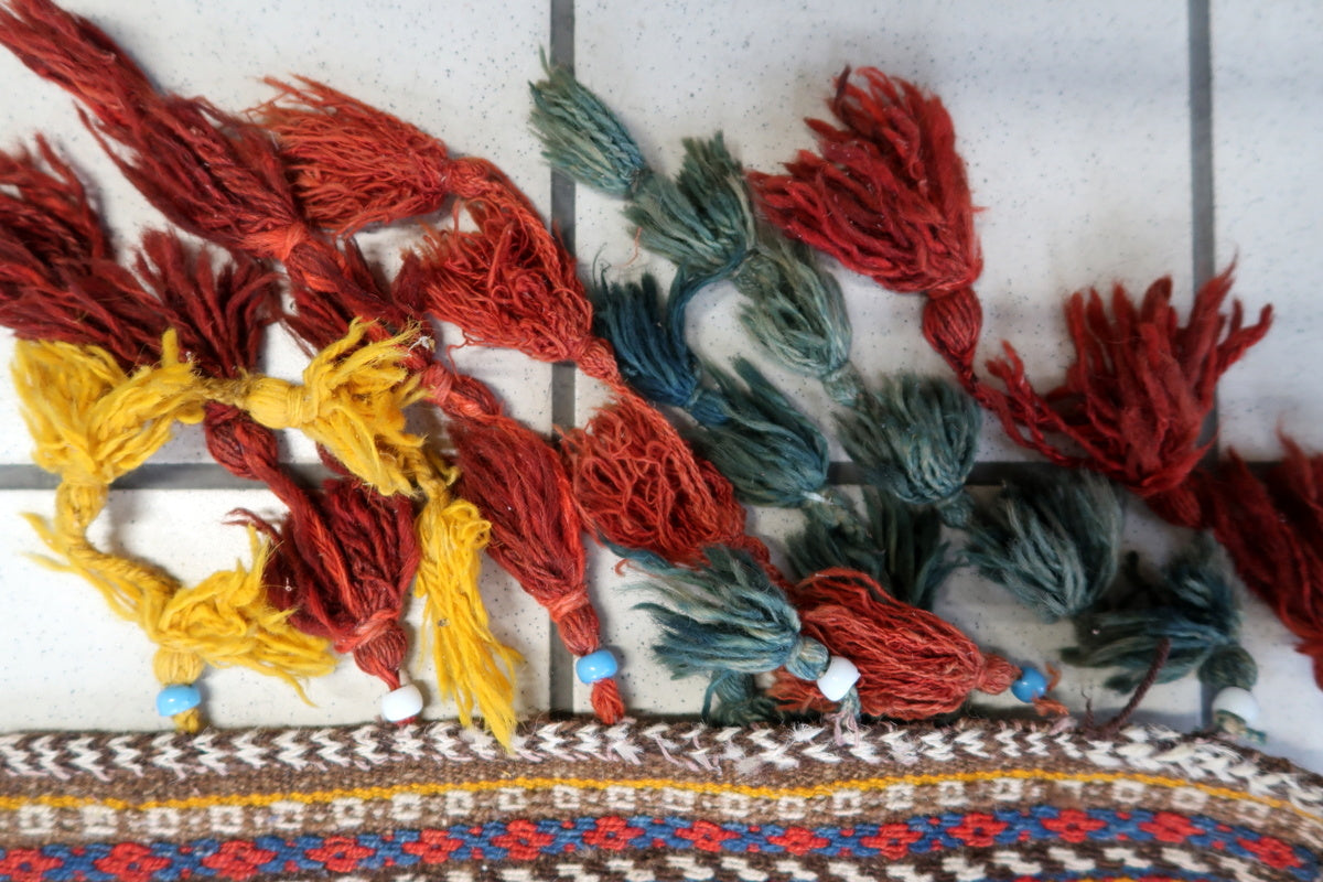 Authentic Moroccan Berber rug displayed on a wooden floor, showcasing its tribal elegance
