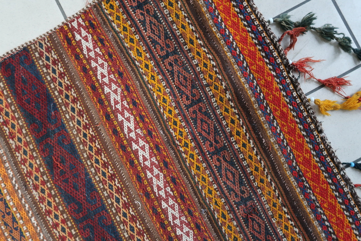 Moroccan Berber rug with original multicolored fringes adding a decorative touch
