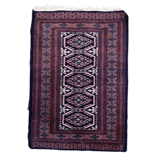 Handmade vintage 1960s Uzbek Bukhara rug with geometric octagonal medallions
