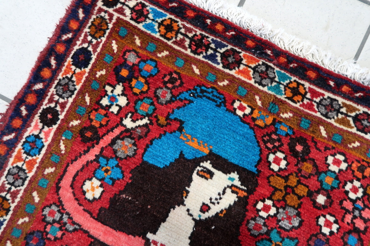 Close-up of handwoven Persian wool rug showing fine details
