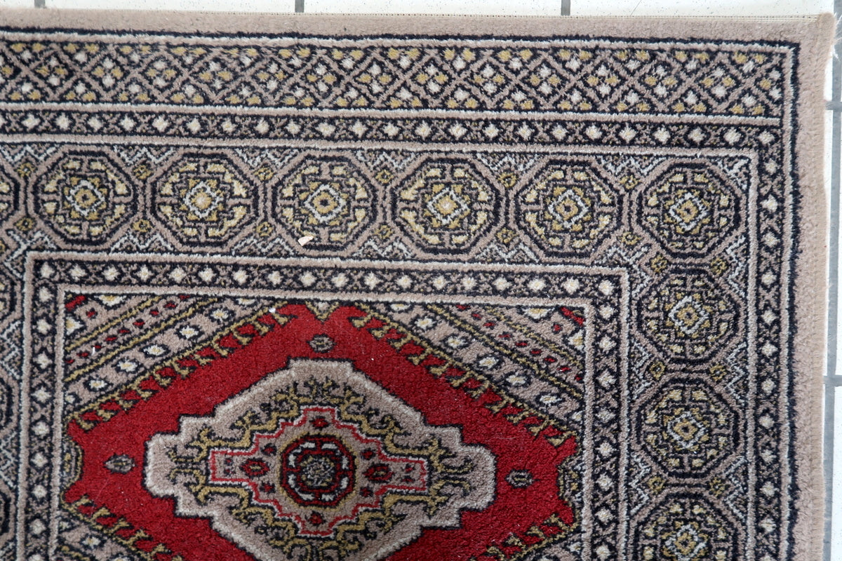 Close-up of intricate geometric motifs on a 1970s German rug
