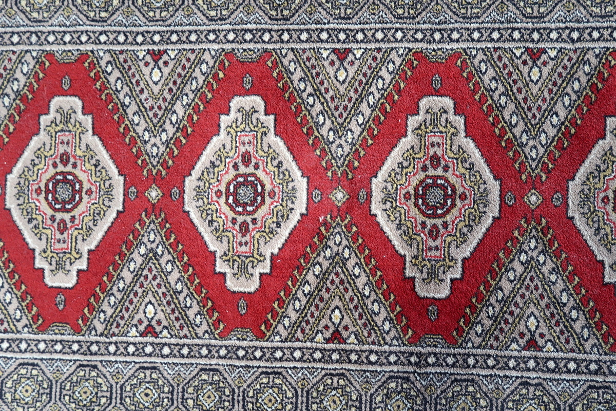 Detailed border design of a vintage 1970s German rug
