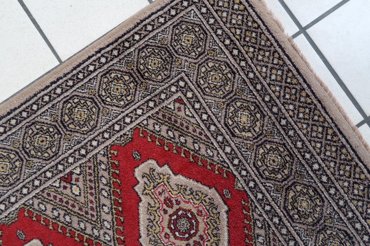 Elegant vintage German rug with bold symmetrical motifs
