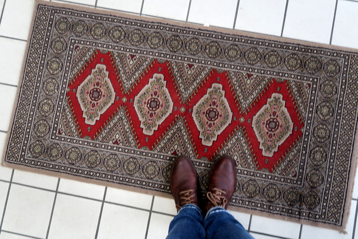 Retro German acrylic rug with diamond medallion patterns
