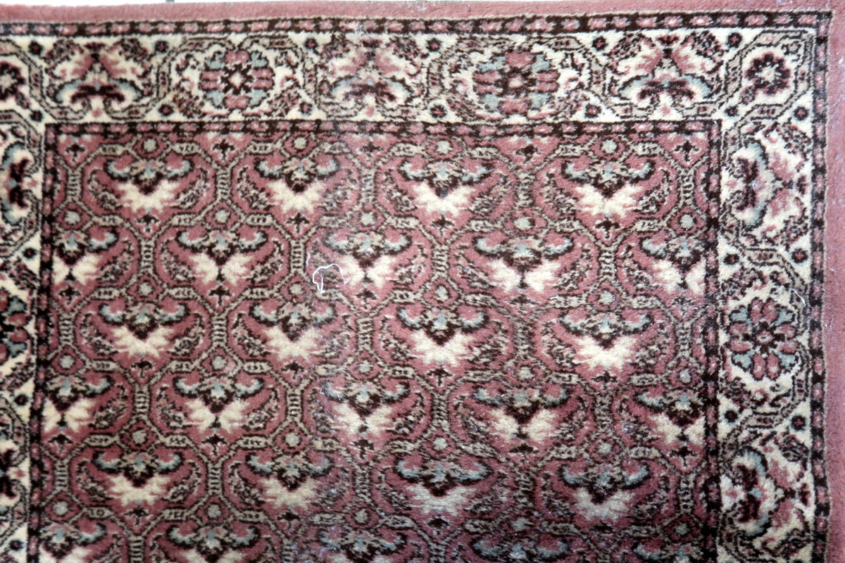 Intricate floral details on a 1970s German Tabriz-style rug
