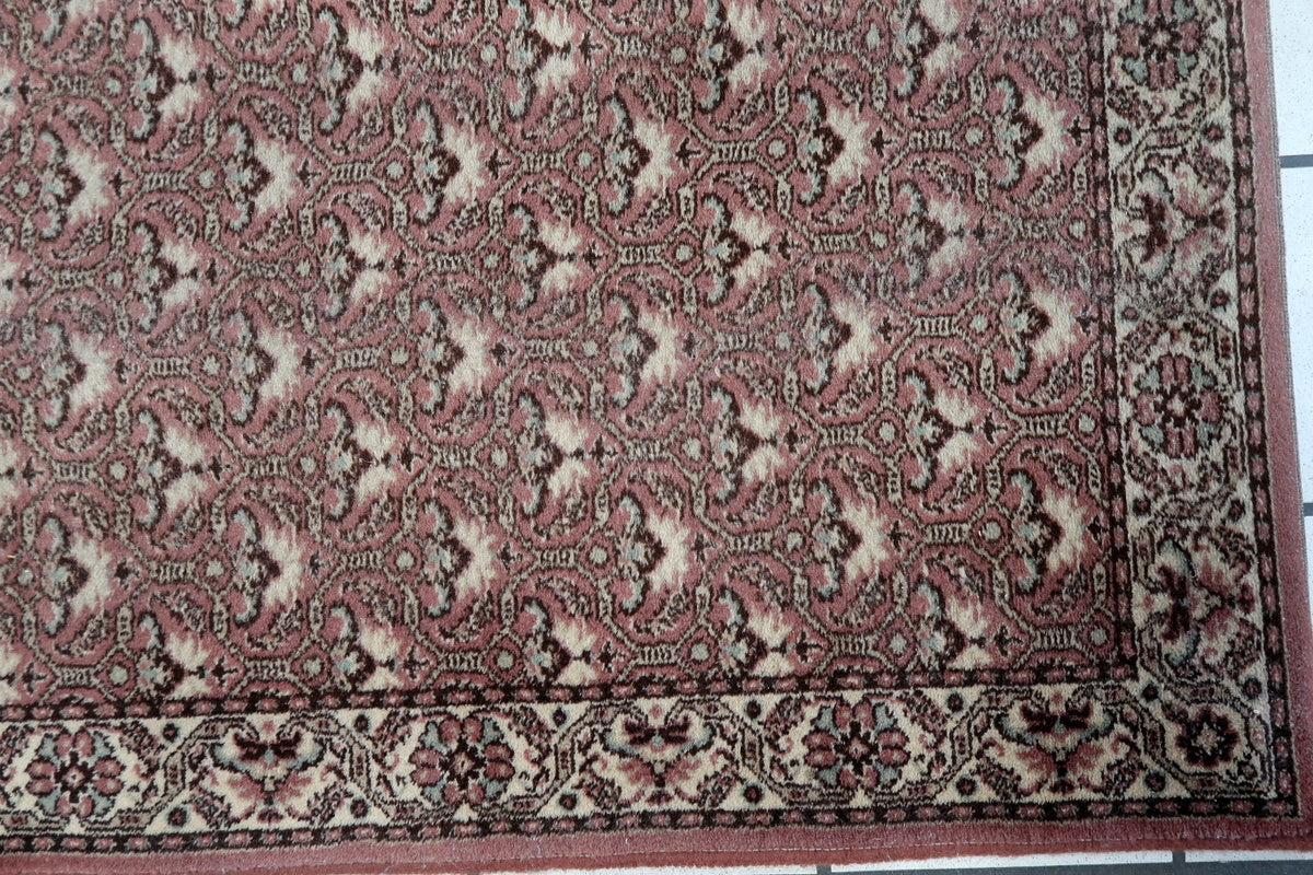 Vintage German runner rug with a timeless floral medallion design
