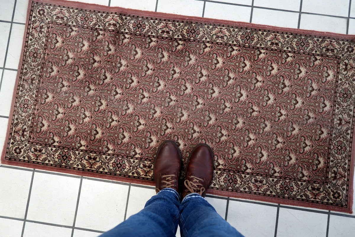 Refined floral patterns on an antique-inspired German carpet
