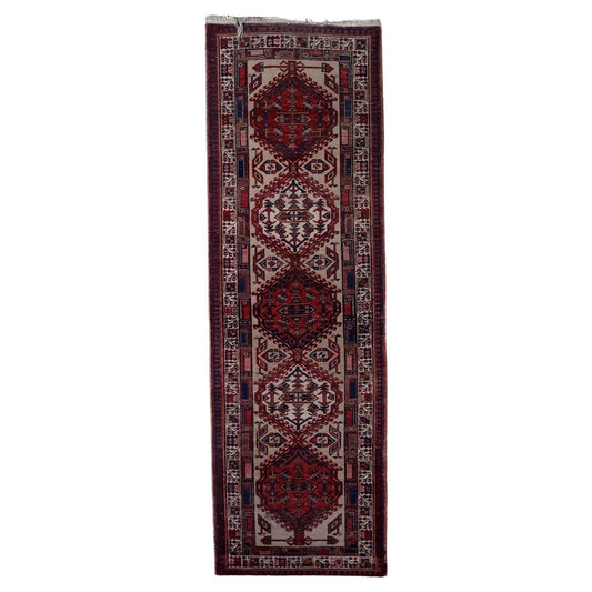 Handmade antique Persian Serab runner rug with intricate tribal patterns
