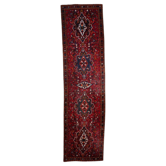 Handmade antique Persian Karajeh runner rug with intricate tribal patterns
