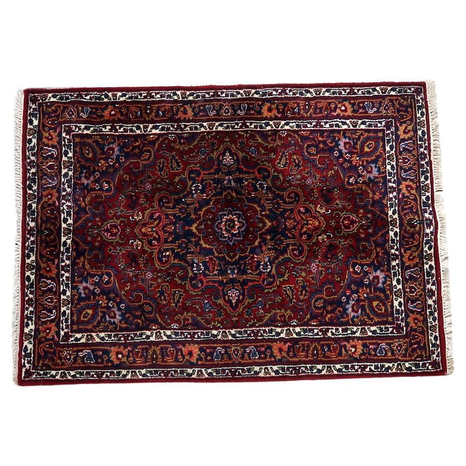 Handmade vintage Persian Hamadan rug with red and blue motifs
