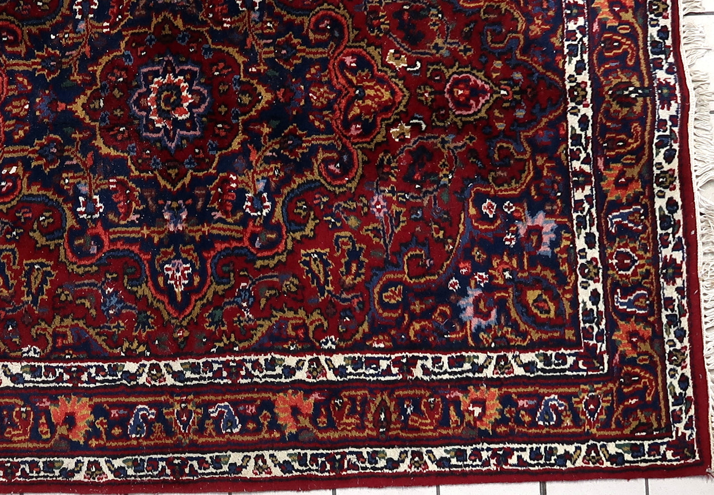 Vintage Persian rug with central medallion design
