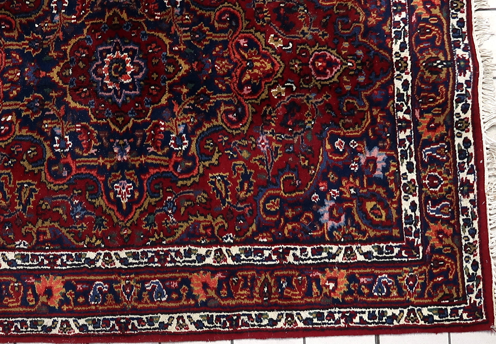 Vintage Persian rug with central medallion design
