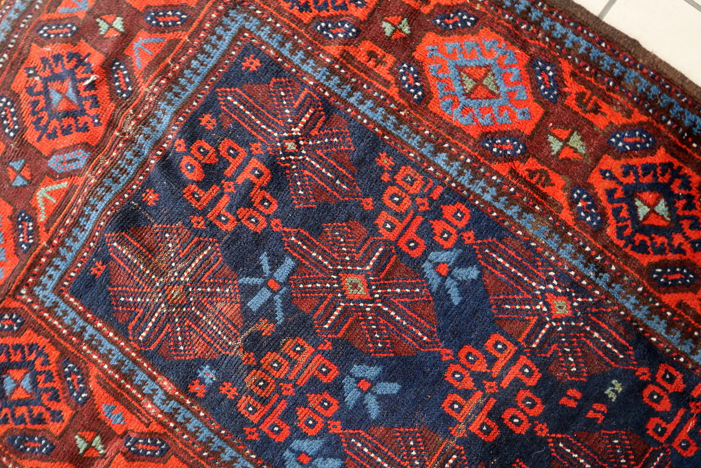 Authentic 1880s Afghan rug showcasing traditional craftsmanship
