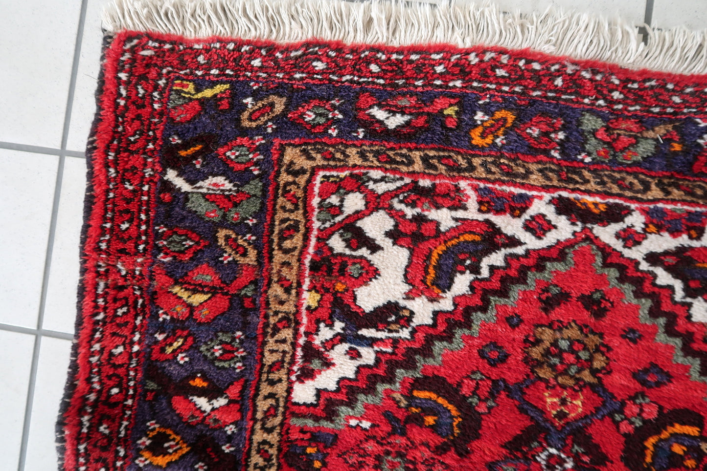 Intricate floral design on a handmade Persian wool rug
