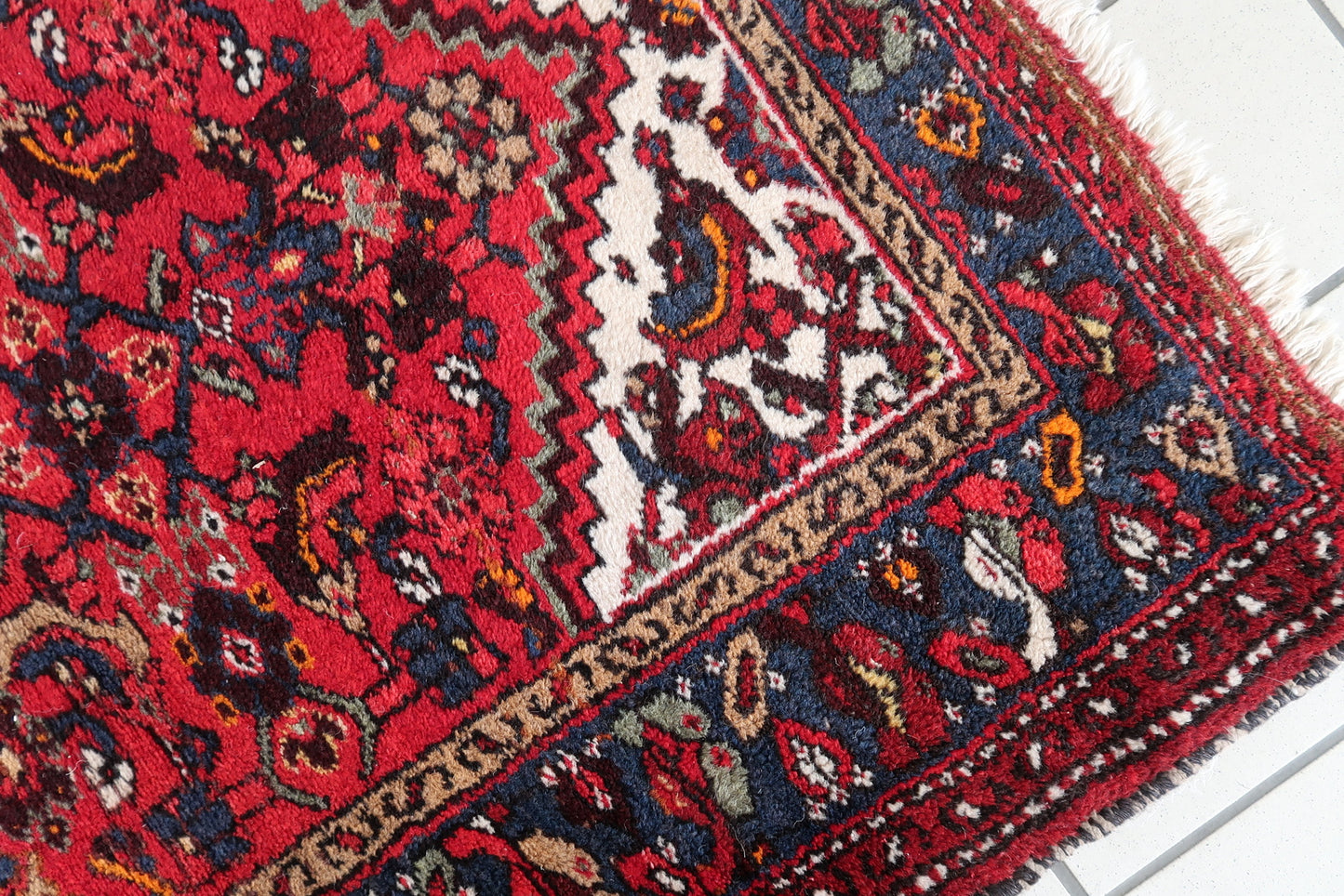 Authentic handmade Persian rug with geometric motifs
