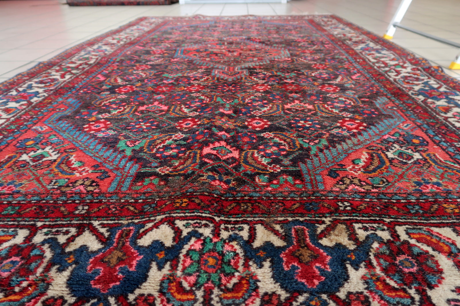 Collectible handmade Persian rug with medallion and floral motifs
