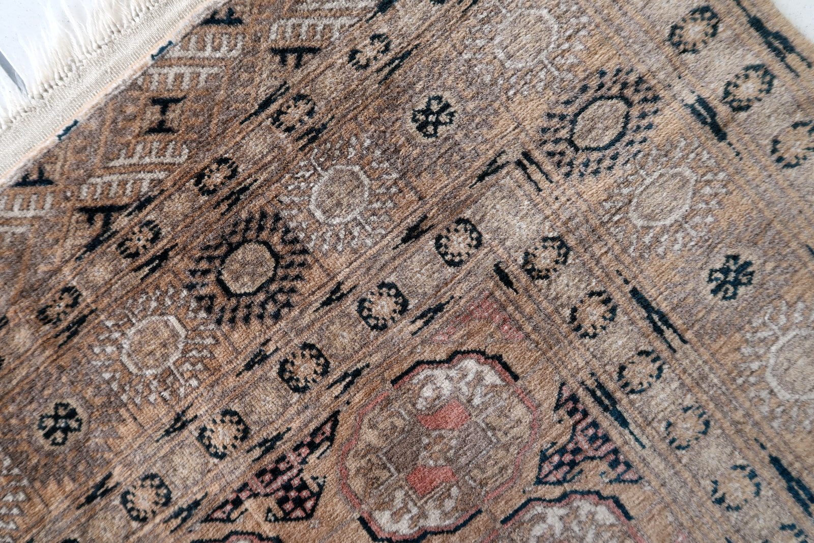 Decorative Afghan wool rug with geometric motifs
