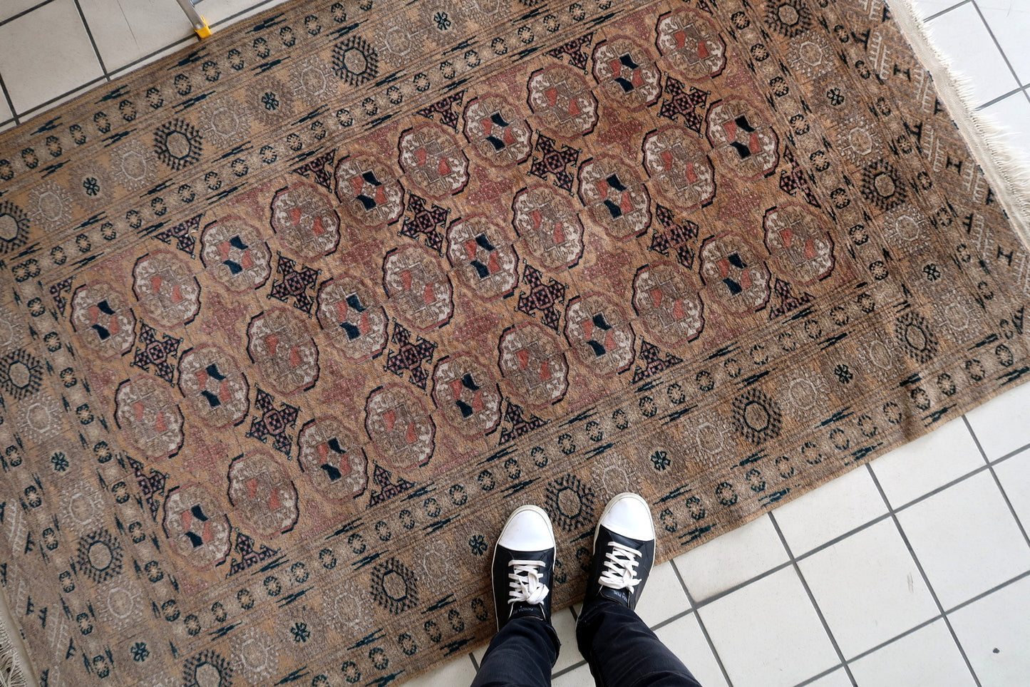 Vintage Afghan rug with blue, white, and black accents
