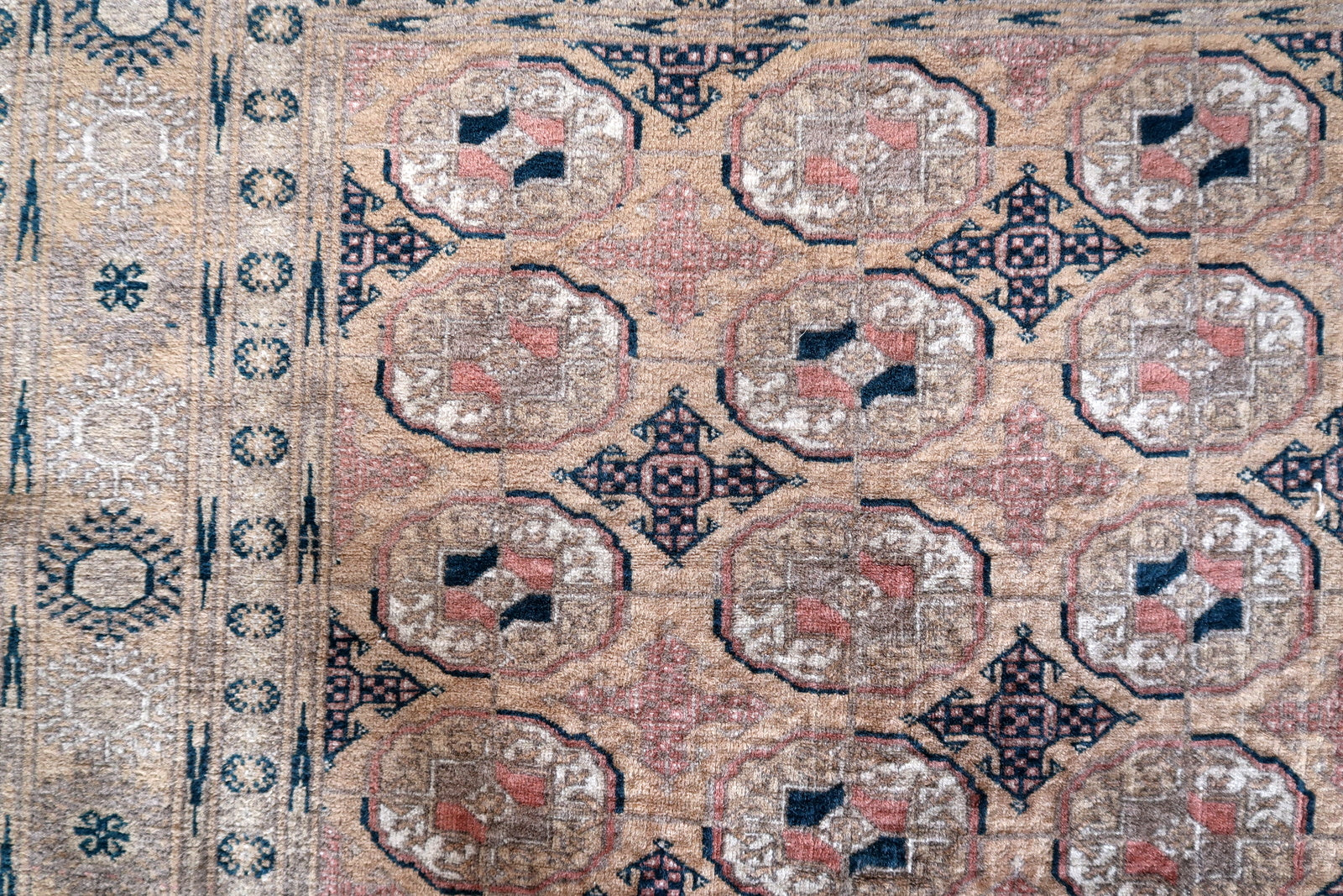 1960s Afghan Baluch rug with rich reddish-brown tones
