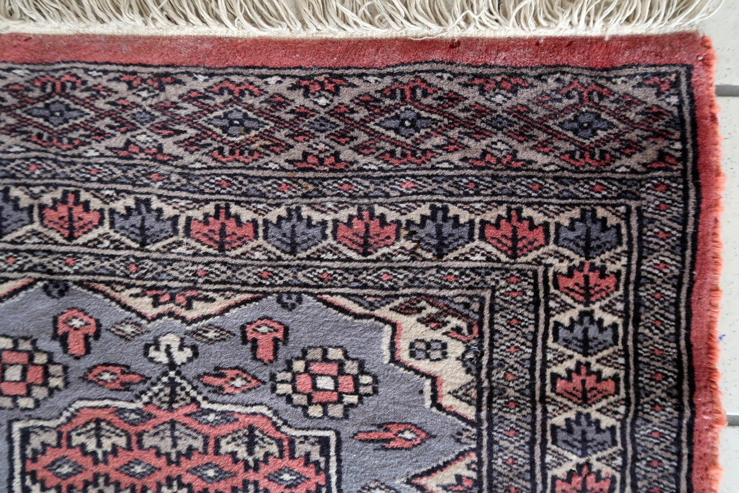 1950s Uzbek wool rug with geometric motifs
