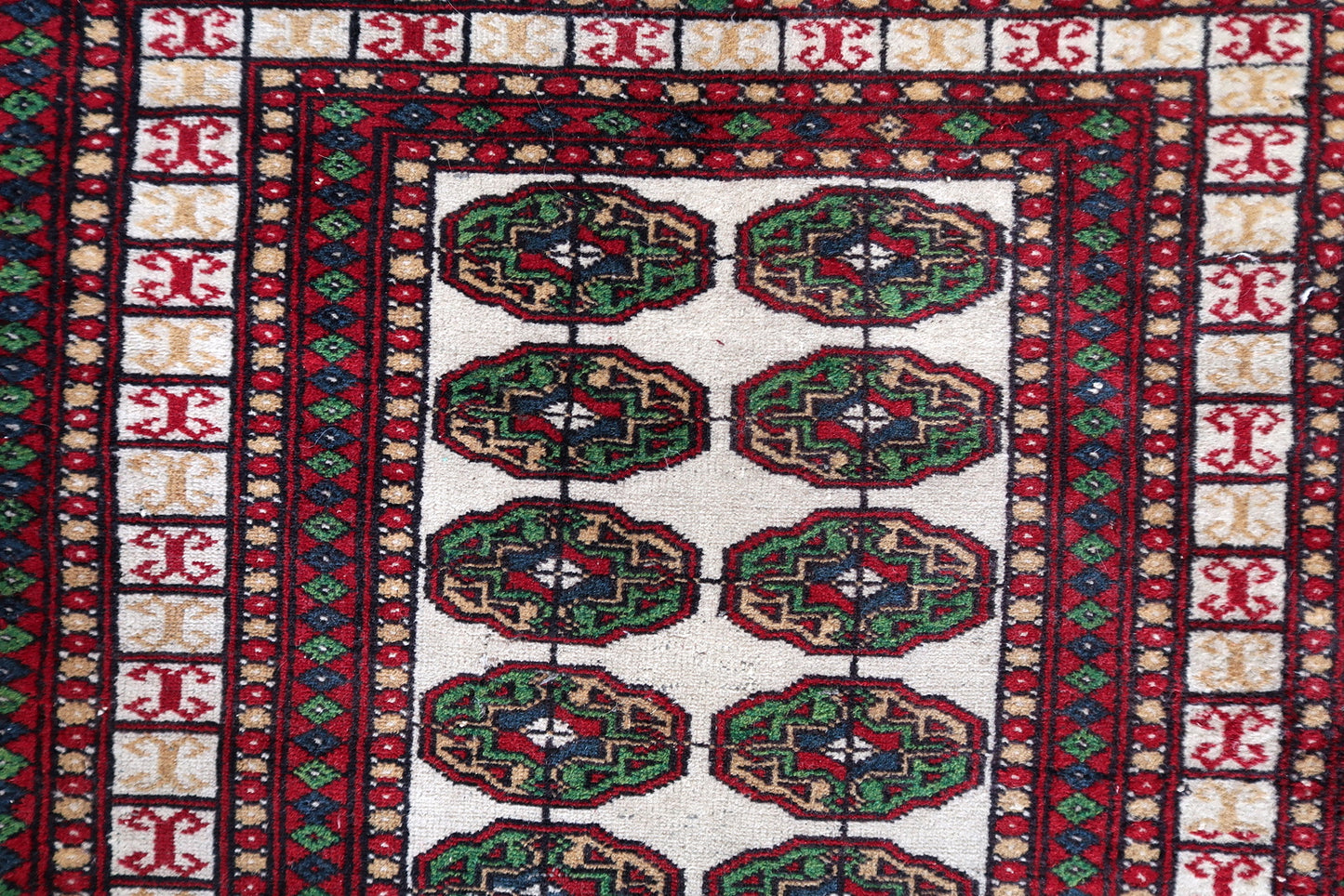 Vintage Bukhara rug with fringes
