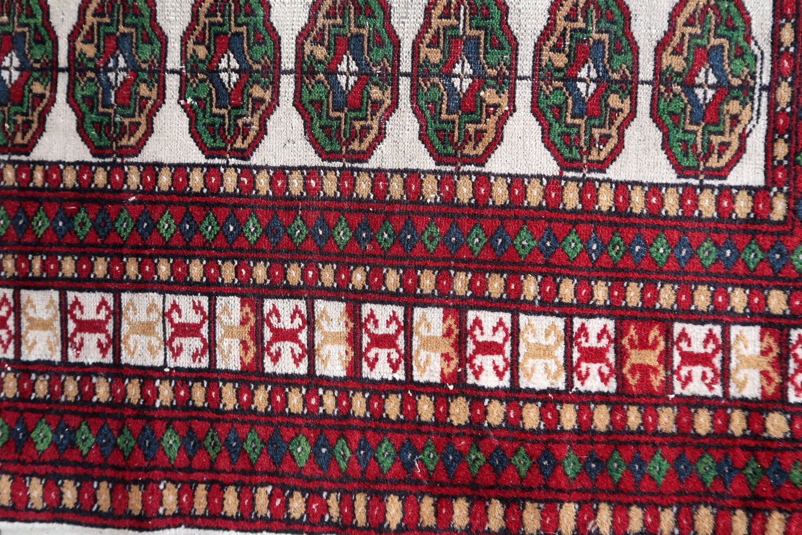 Intricate floral motifs on Bukhara rug
