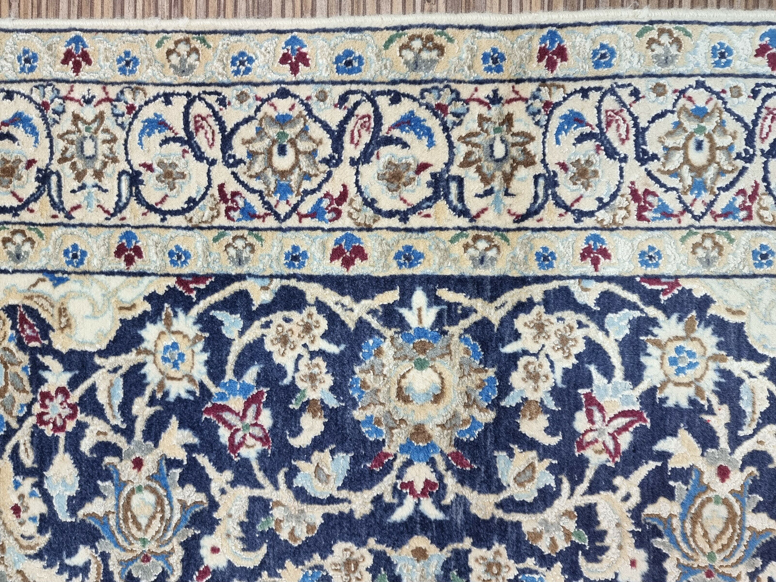 Close-up of the silk highlights on the wool Nain rug
