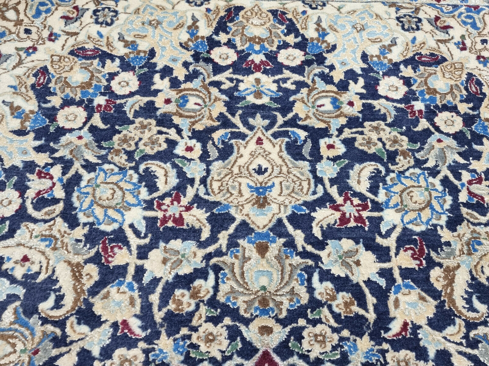 Rich blue and cream color palette of the Nain rug
