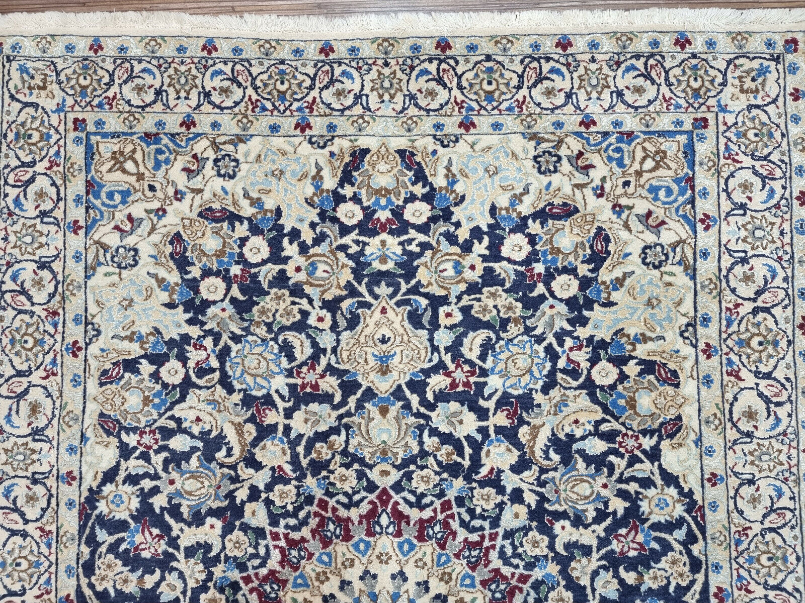 Close-up of the Nain rug’s ornate designs and floral elements
