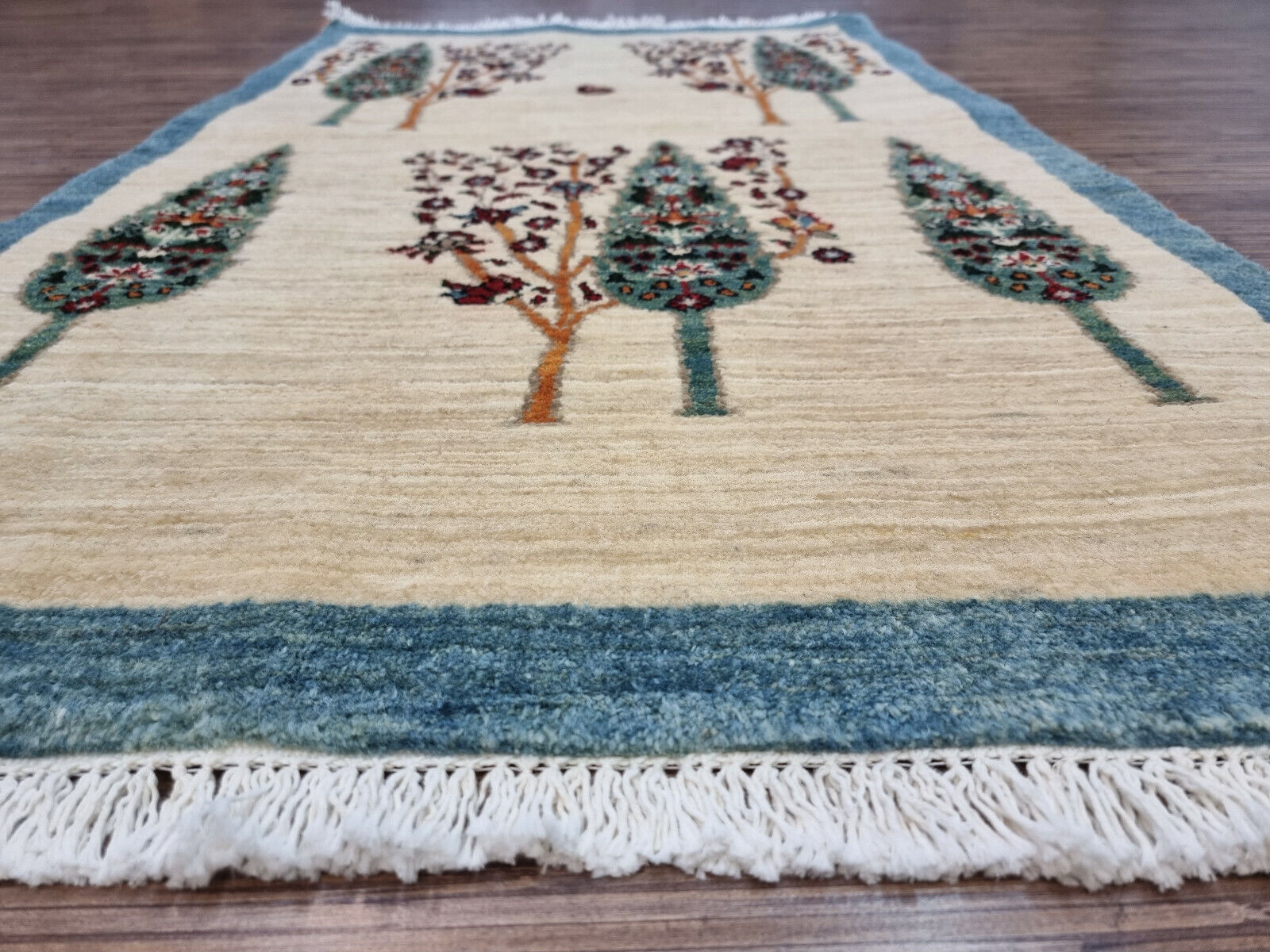 Persian wool rug featuring a tree motif
