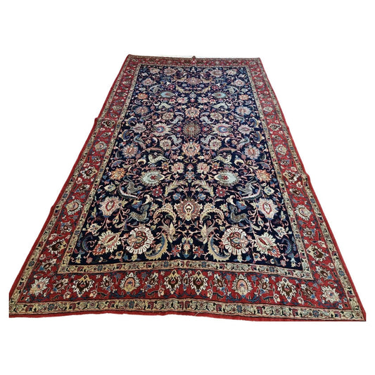 Antique Persian Qum carpet with intricate oriental pattern
