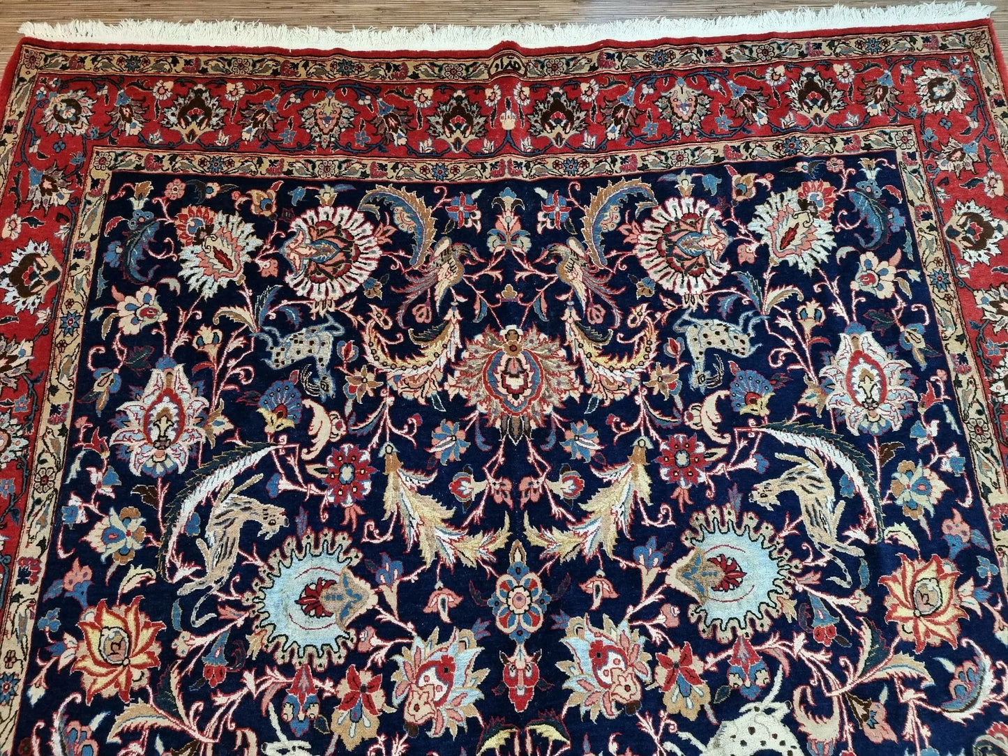 Close-up of Persian Qum hand-knotted floral pattern
