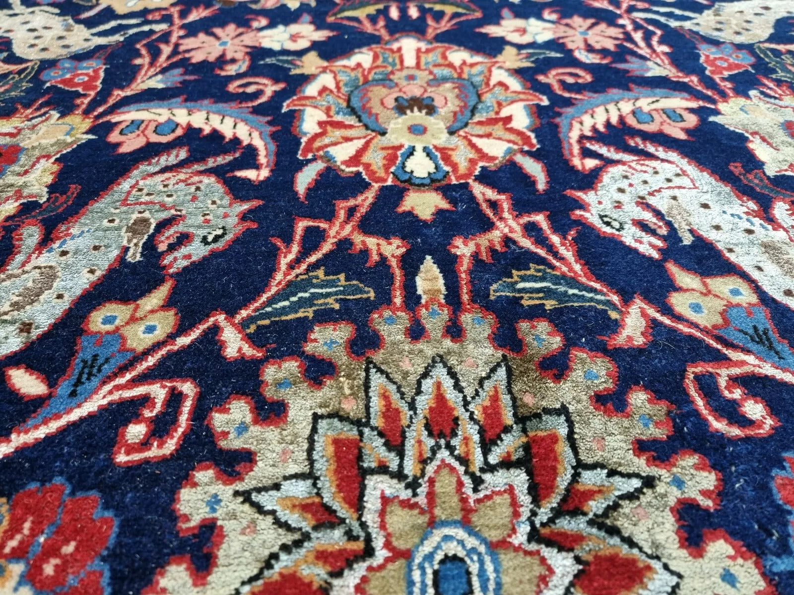 Blue Persian carpet with wool and silk design
