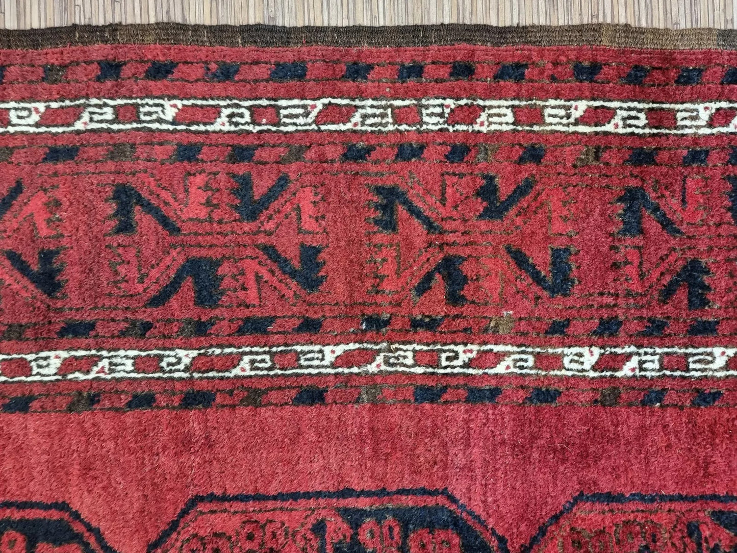 Afghan Ersari wool carpet close-up of details
