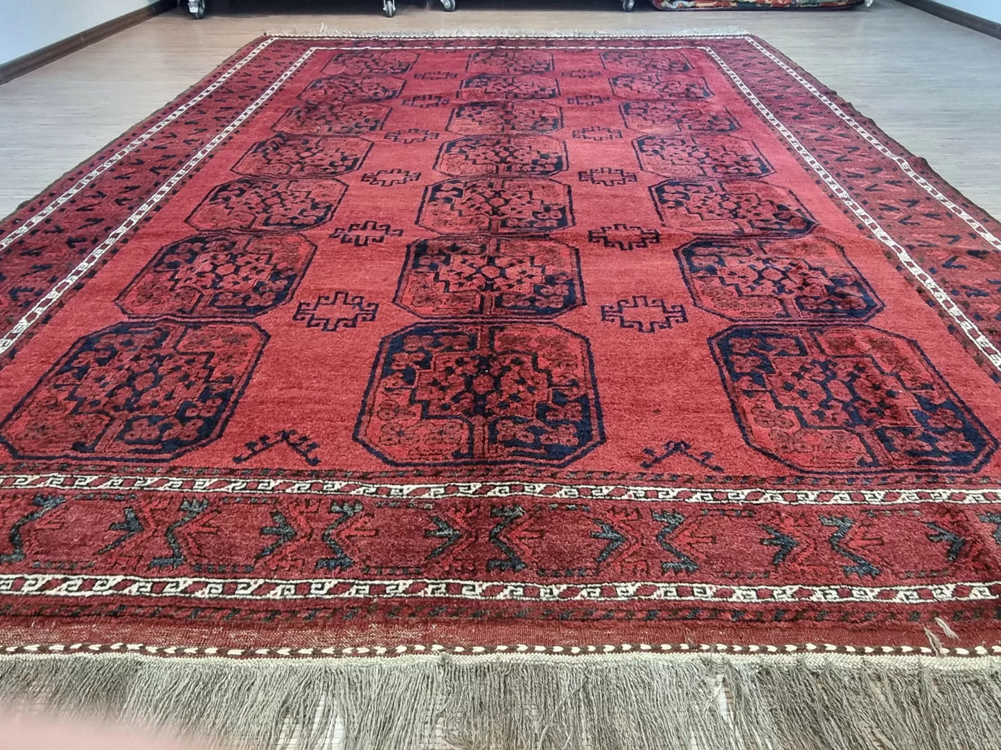 Intricate Afghan Ersari motifs on a hand-knotted rug
