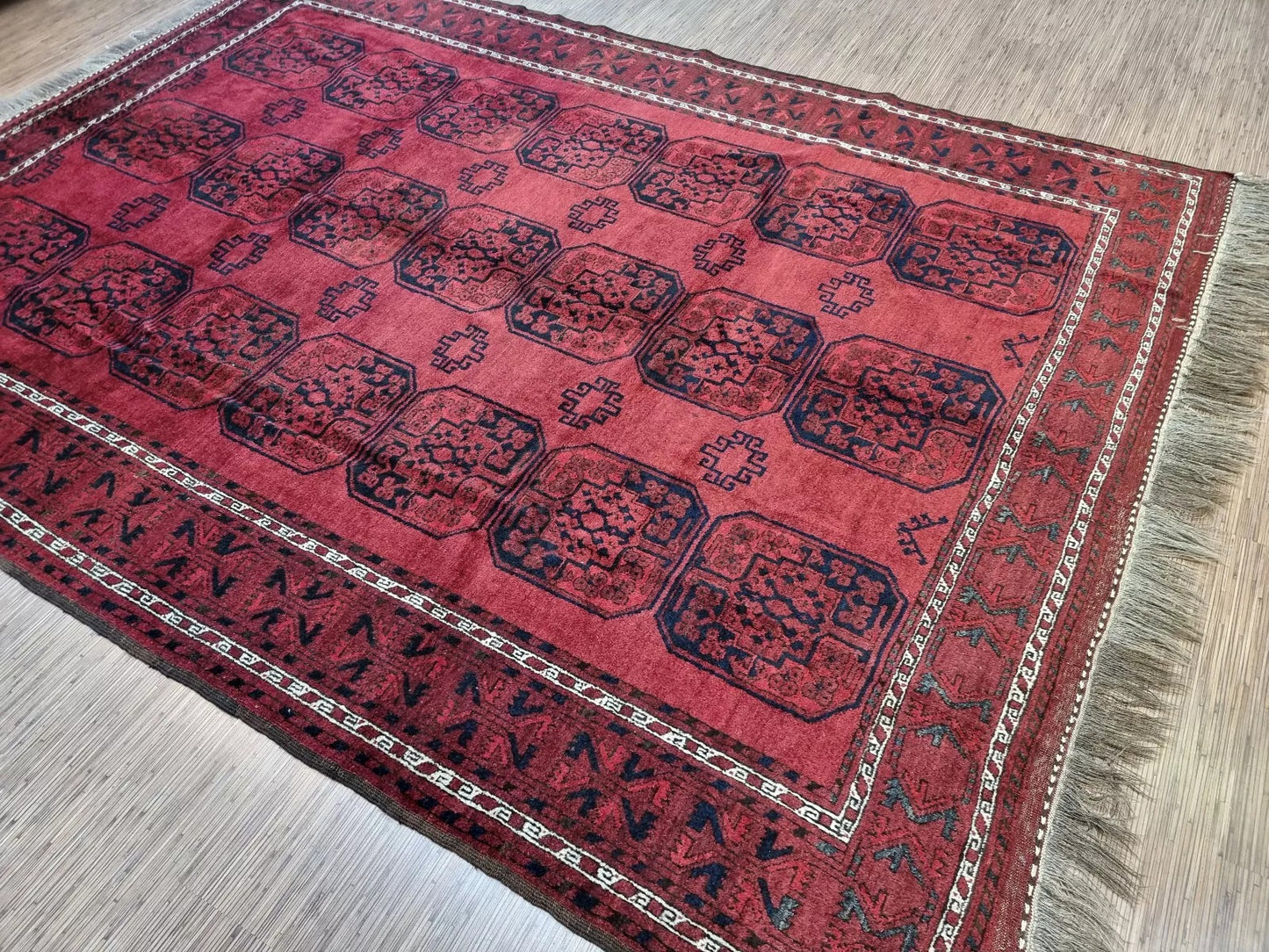 Hand-knotted Afghan red carpet with tribal design
