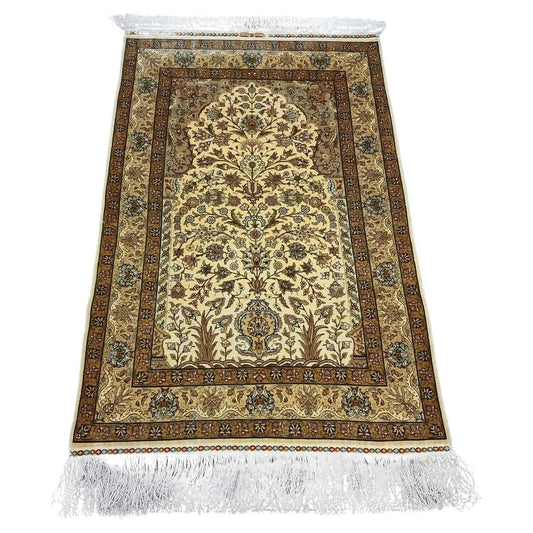 Turkish Hereke silk prayer rug with golden hues and floral motifs
