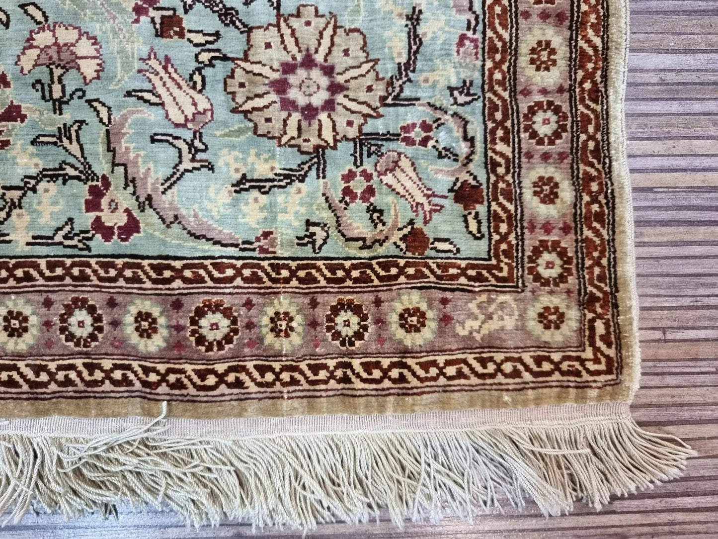 Pure silk vintage rug with beige, gold, and green tones
