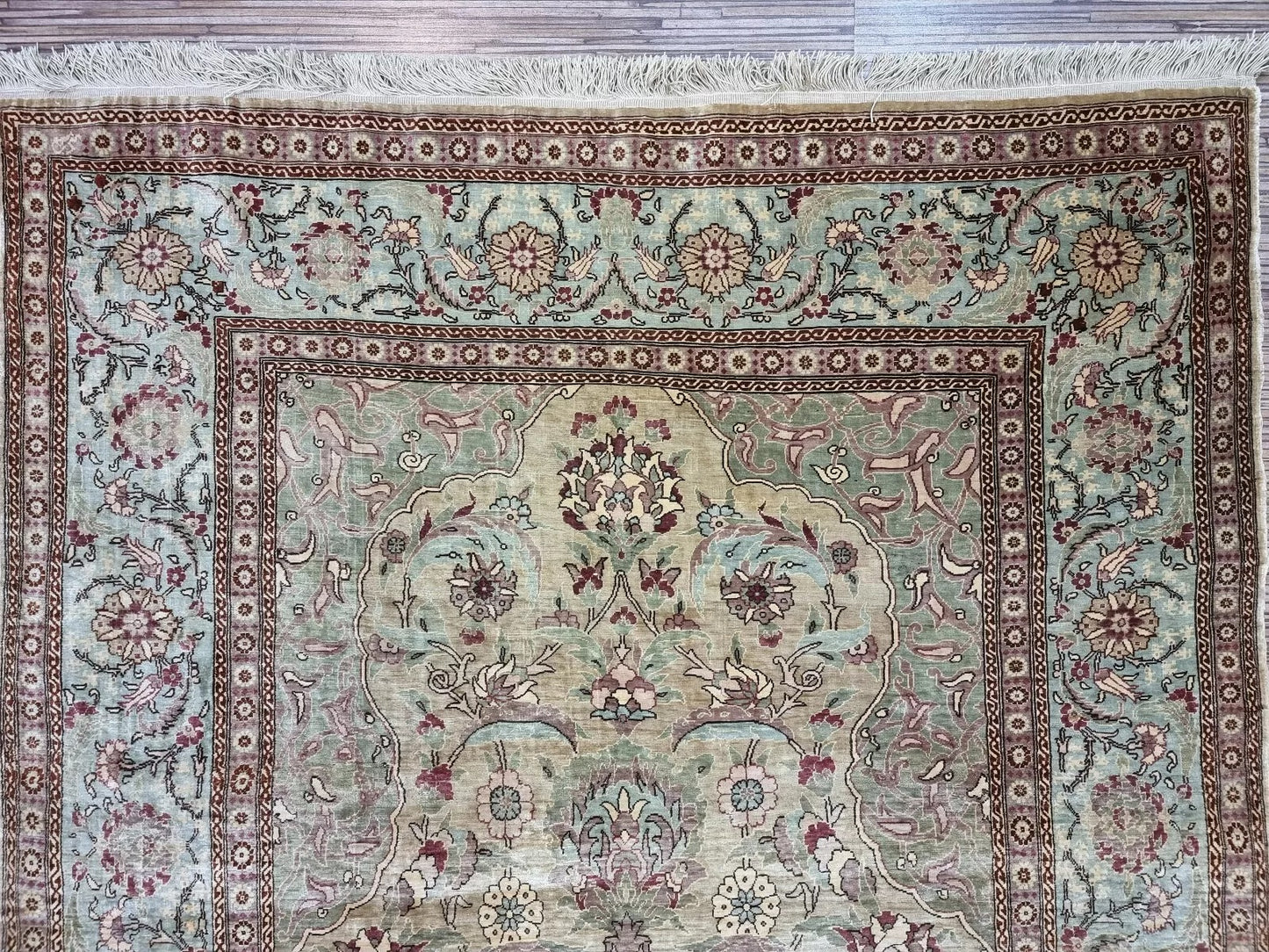 Signed Turkish Hereke rug showcasing traditional Oriental craftsmanship
