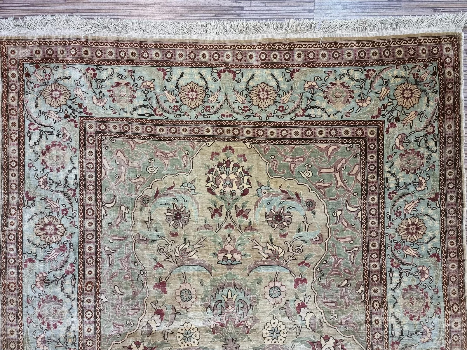 Signed Turkish Hereke rug showcasing traditional Oriental craftsmanship
