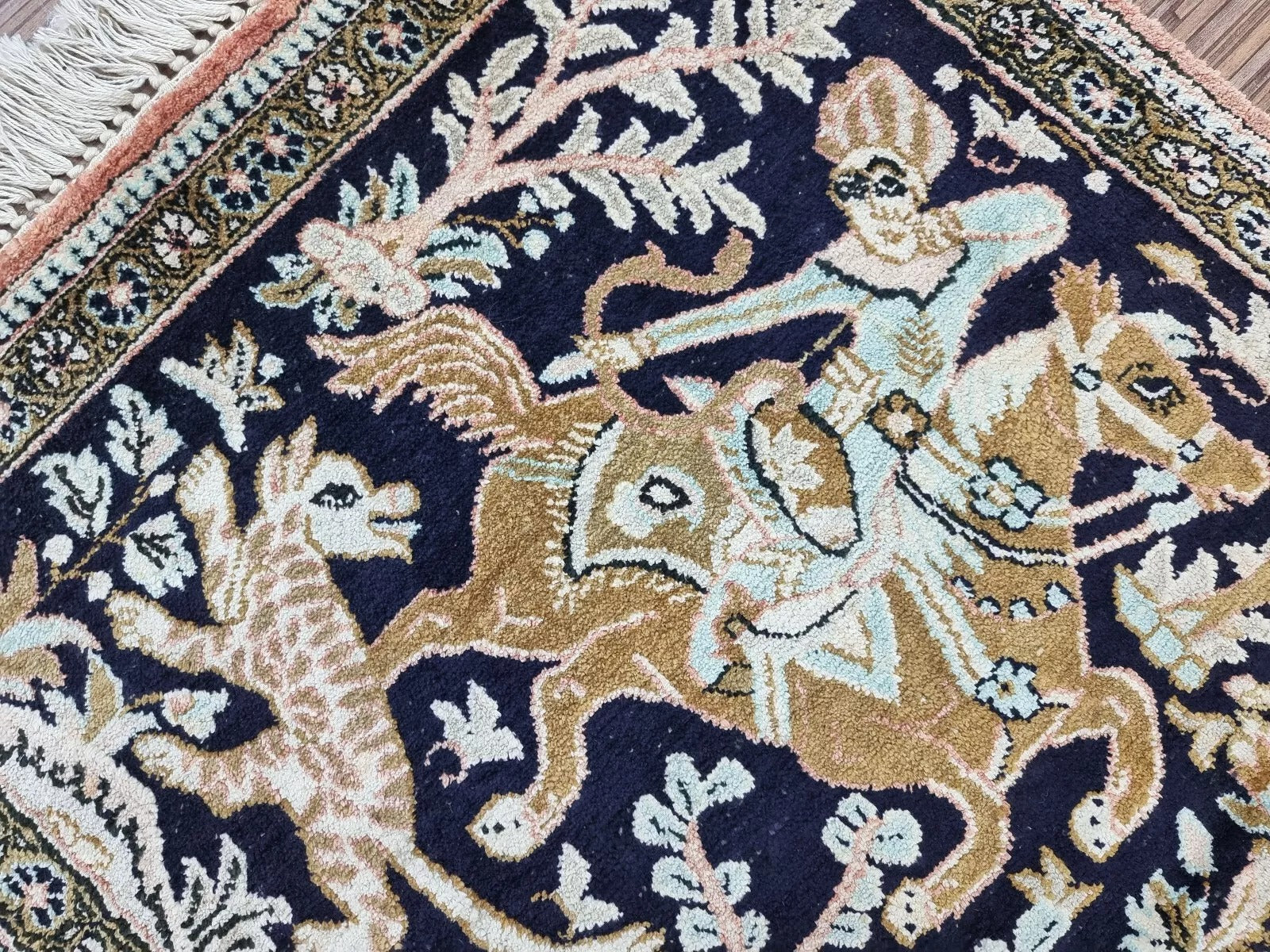 Rich golden beige, pink, and ivory details on the Persian Qum rug's hand-knotted surface
